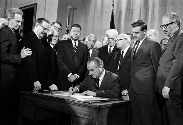 President Johnson signs Fair Housing Act on April 11, 1968